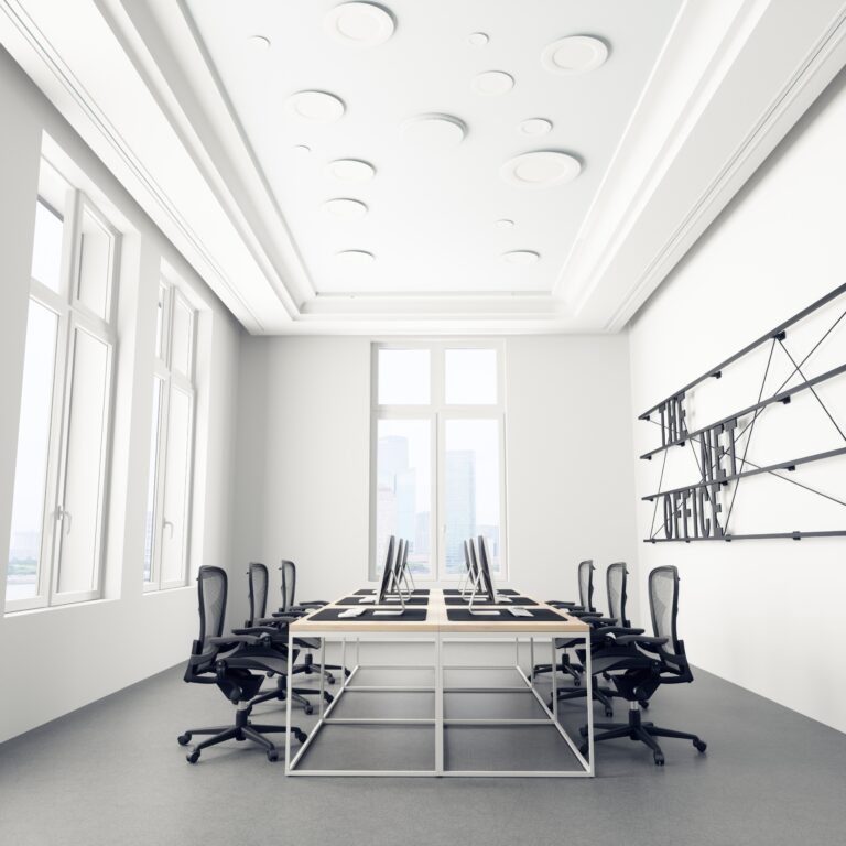Modern office interior with white walls, concrete floor, white computer tables and black chairs. 3d rendering mock up